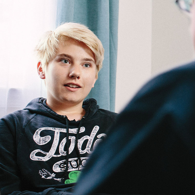 Talk Therapy A client sitting in front of a window talking to their Loudon psychologist.